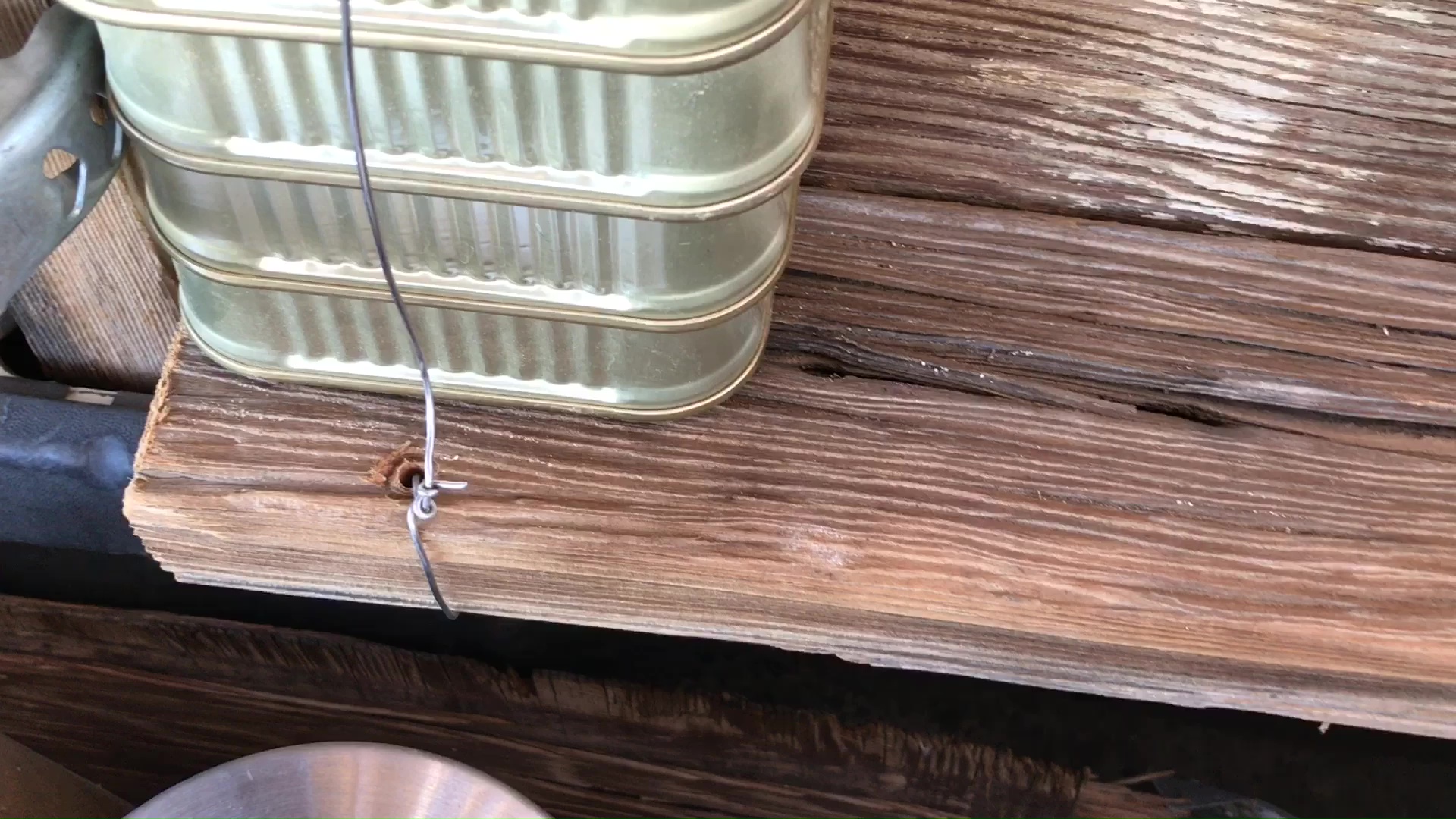 01 Drilled Attachment Point At Base Of First Column Of Wire Secured Fish Cans