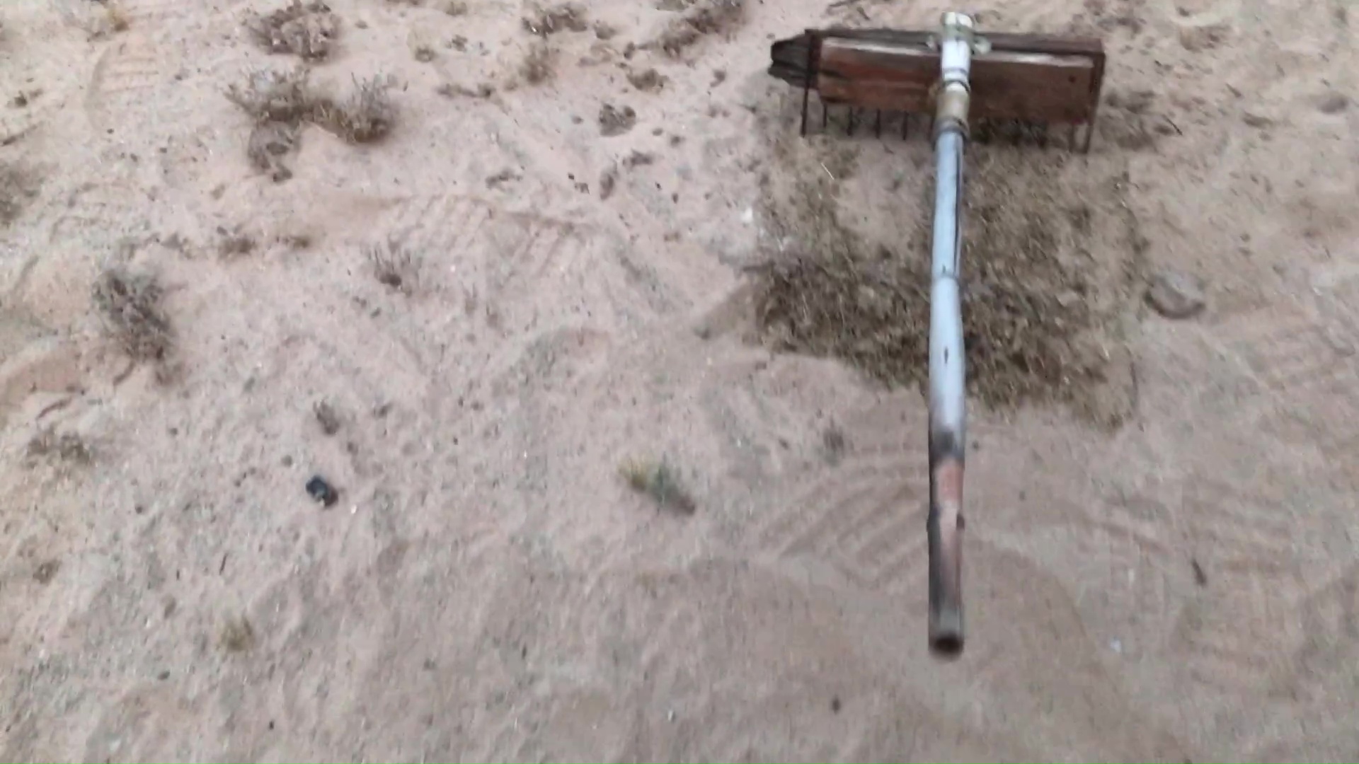 01 Makeshift DIY Rake For Composting Weeds Made Of A Scavenged BBQ Grill Sardine Can And Bamboo Pole