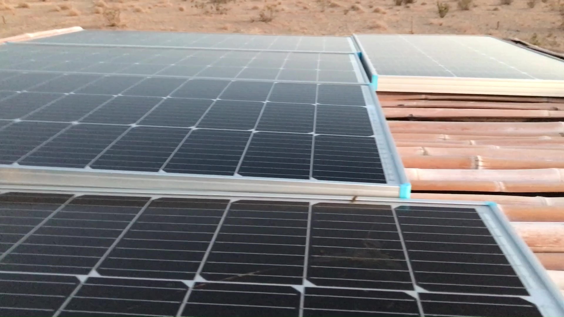 01 Solar Panel Array On Bamboo Pole Fence Roof