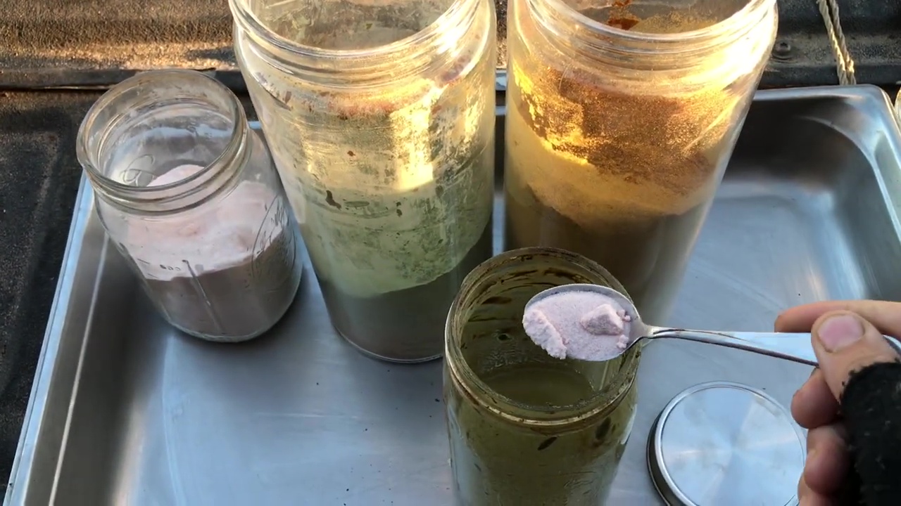 02 Pouring A Teaspoon Of Salt Into Fermentation Jar