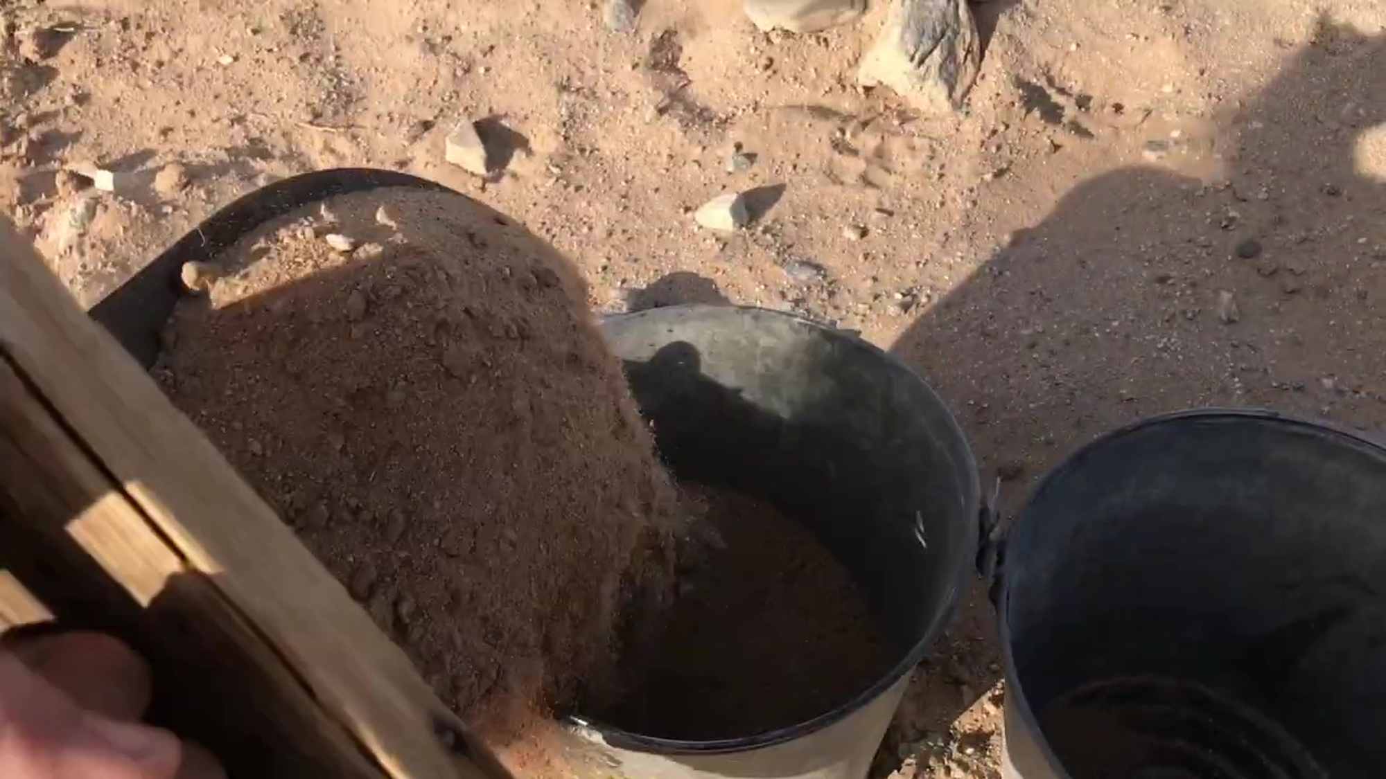 03 Filling Metal Pails With Sand