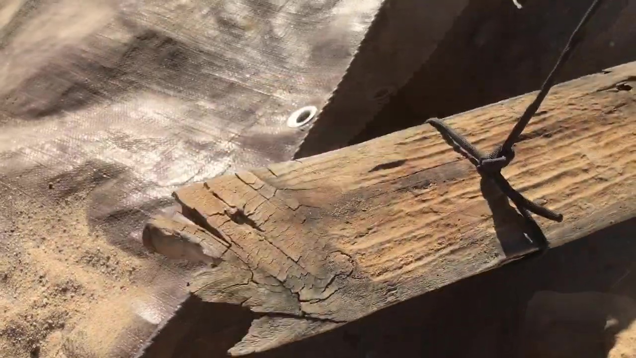 04 Dropping Wood Anchor Into Dug Hole