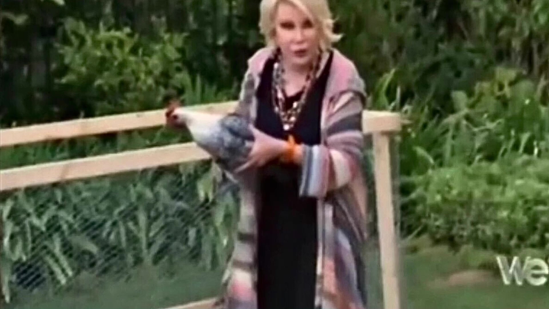 08 Joan Rivers Picking Up And Moving Chicken In Backyard 02