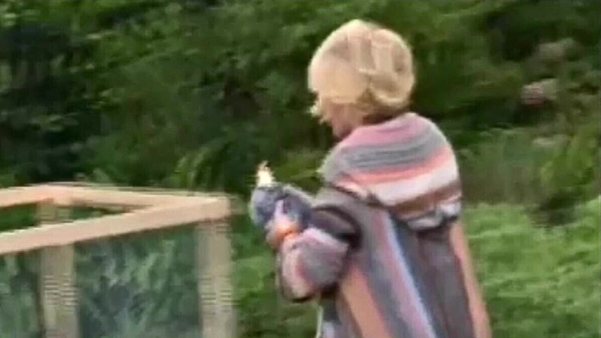 10 Joan Rivers Picking Up And Moving Chicken In Backyard 04