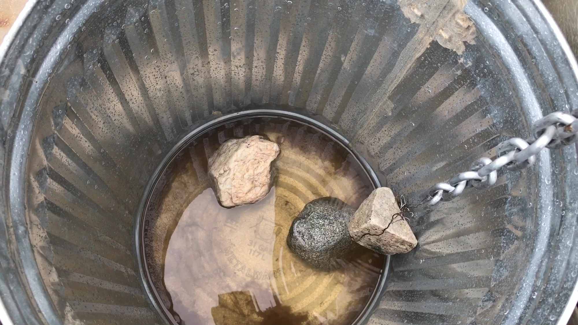 Rain Chain Filling Galvanized Trash Can