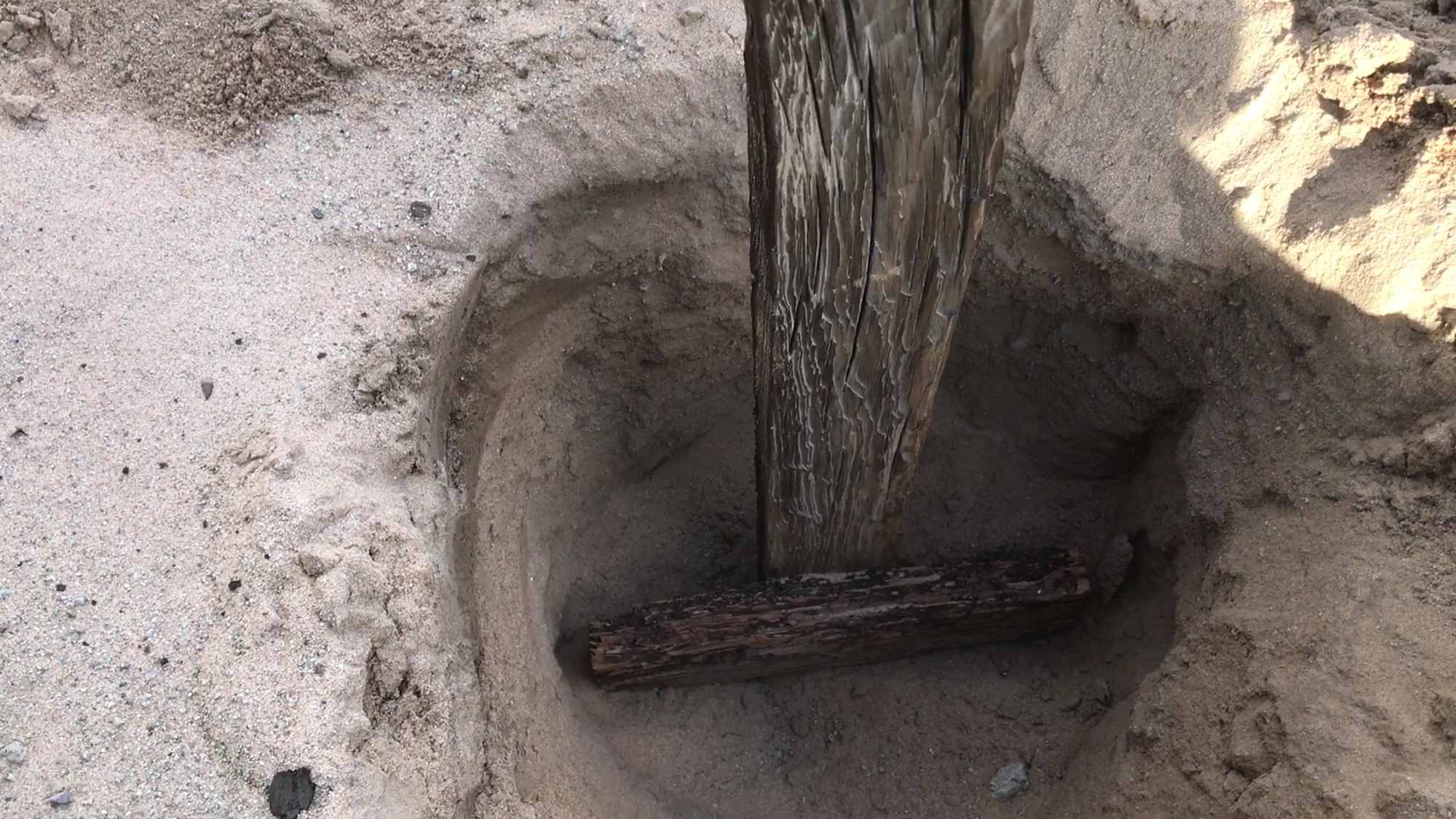 Scavenged Scrap Wood Structural In Ground Support Beam Anchor to Resist Desert Sand and Wind Storms