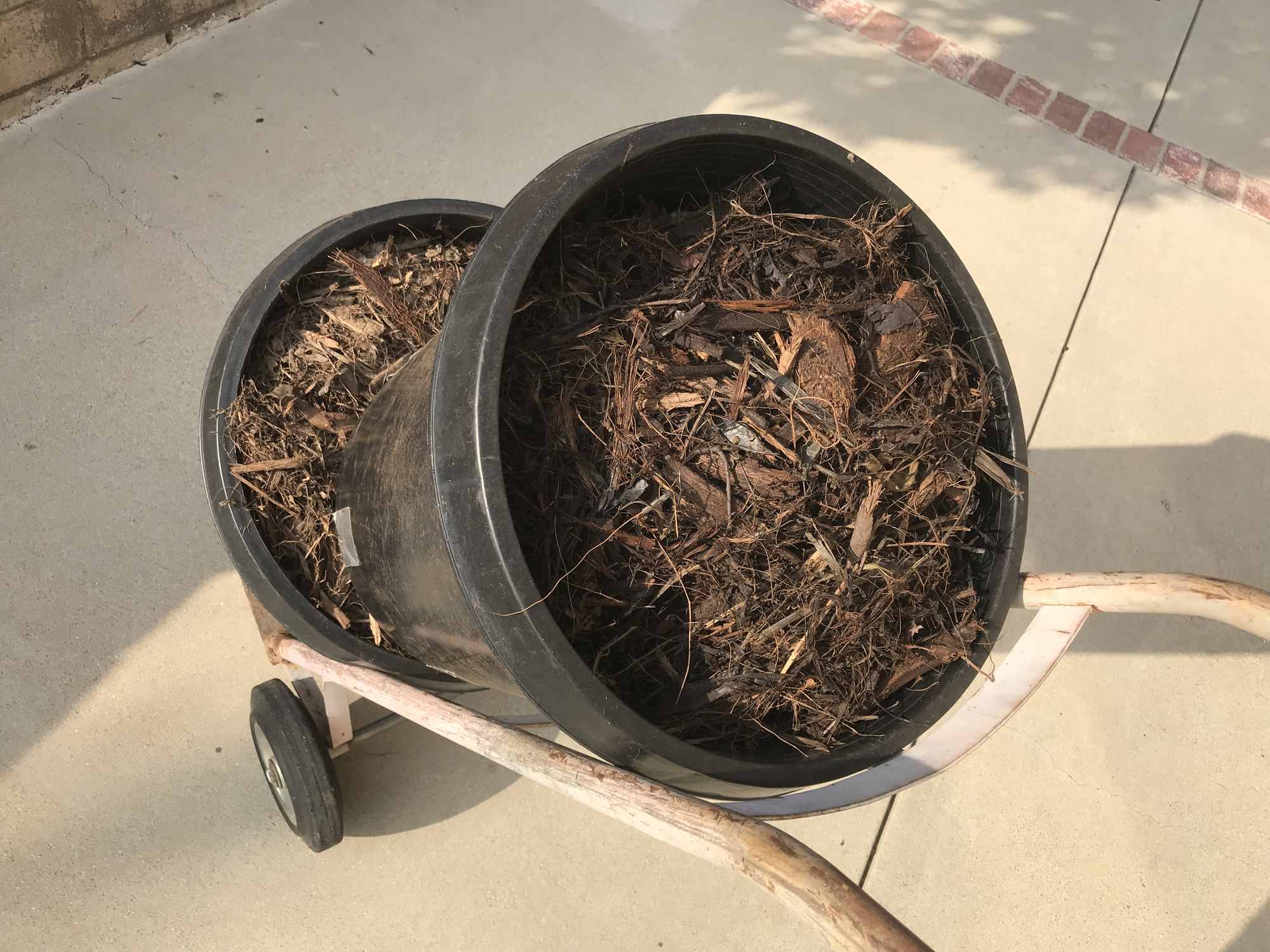 Two 15 Gallon Tree Pots Stacked on Hand Truck for Mulch Spreading