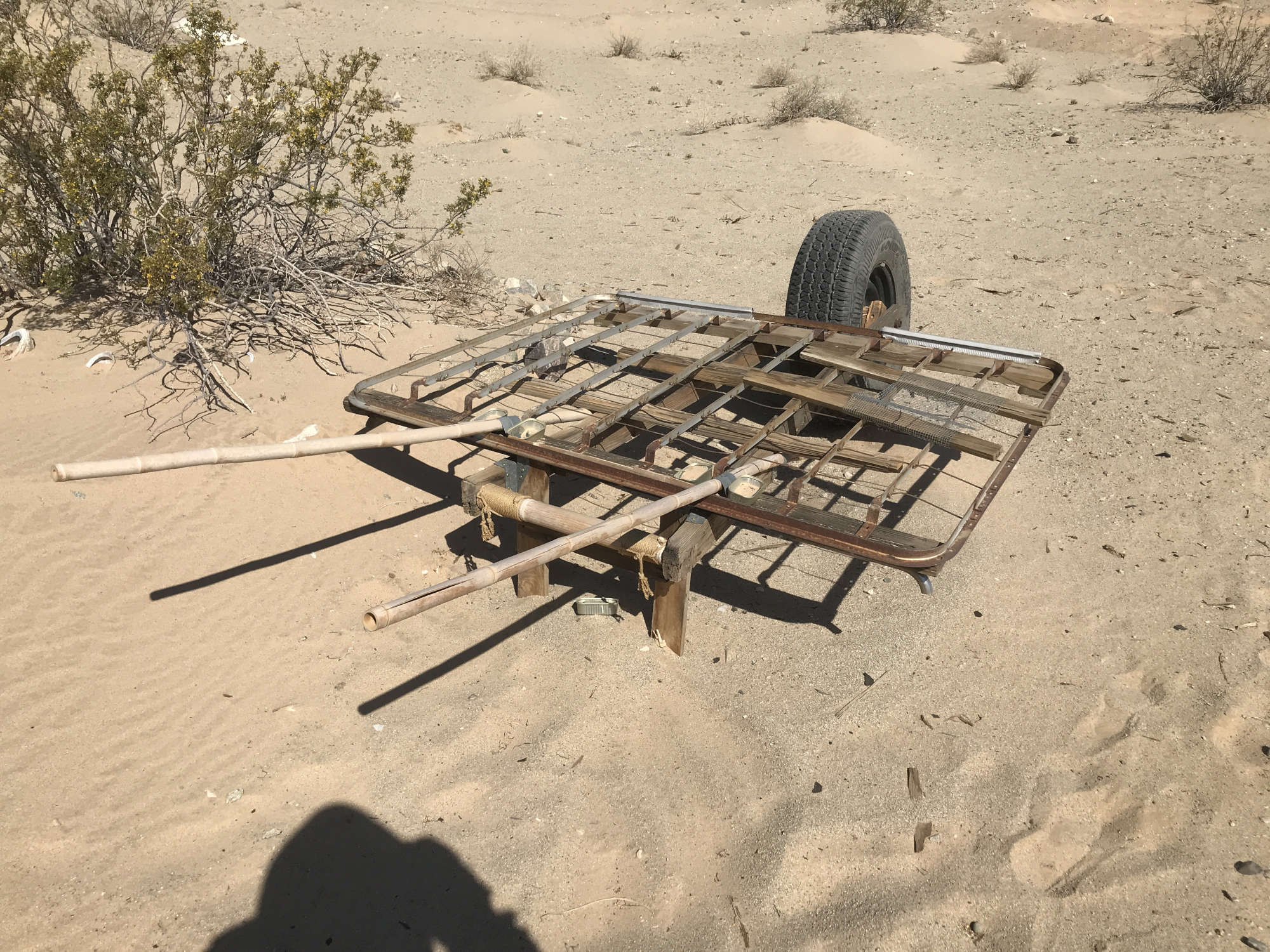 Upcycled Metal Bed Frame Converted to Oversize Rolling Truck Wheel Barrow Platform