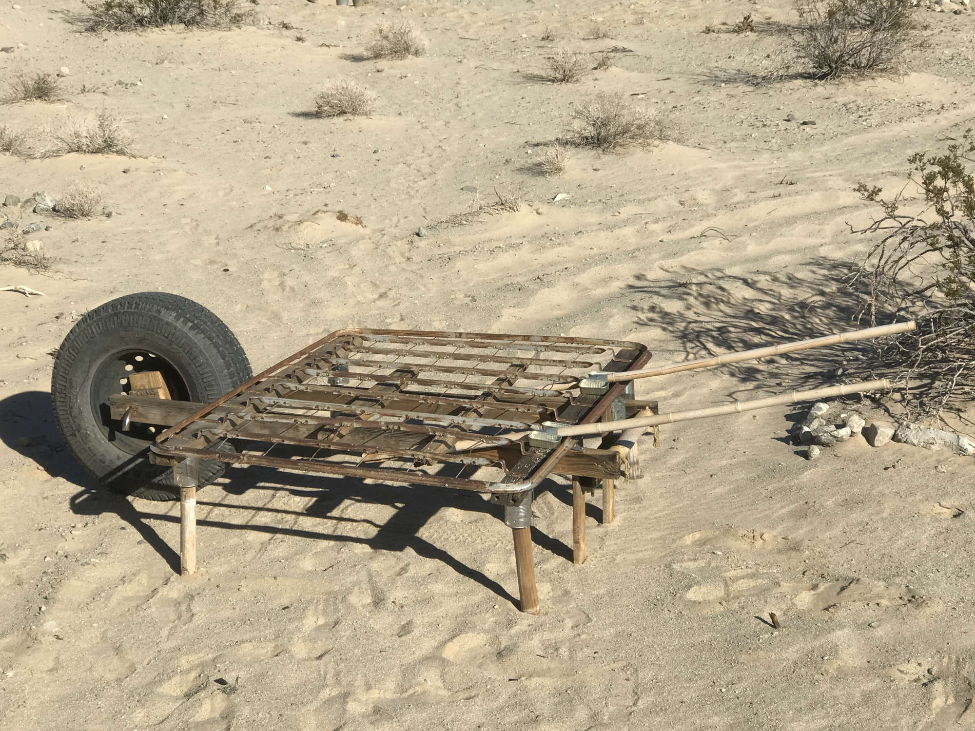 Upcycled Metal Bed Frame Converted to Oversize Rolling Truck Wheel Barrow Platform